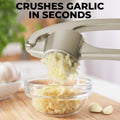 Zulay Kitchen Premium Garlic Press Set - Rust Proof & Dishwasher Safe Professional Garlic Mincer Tool - Easy-Squeeze, Easy-Clean with Soft, Ergonomic Handle - Silicone Garlic Peeler & Brush (Silver)